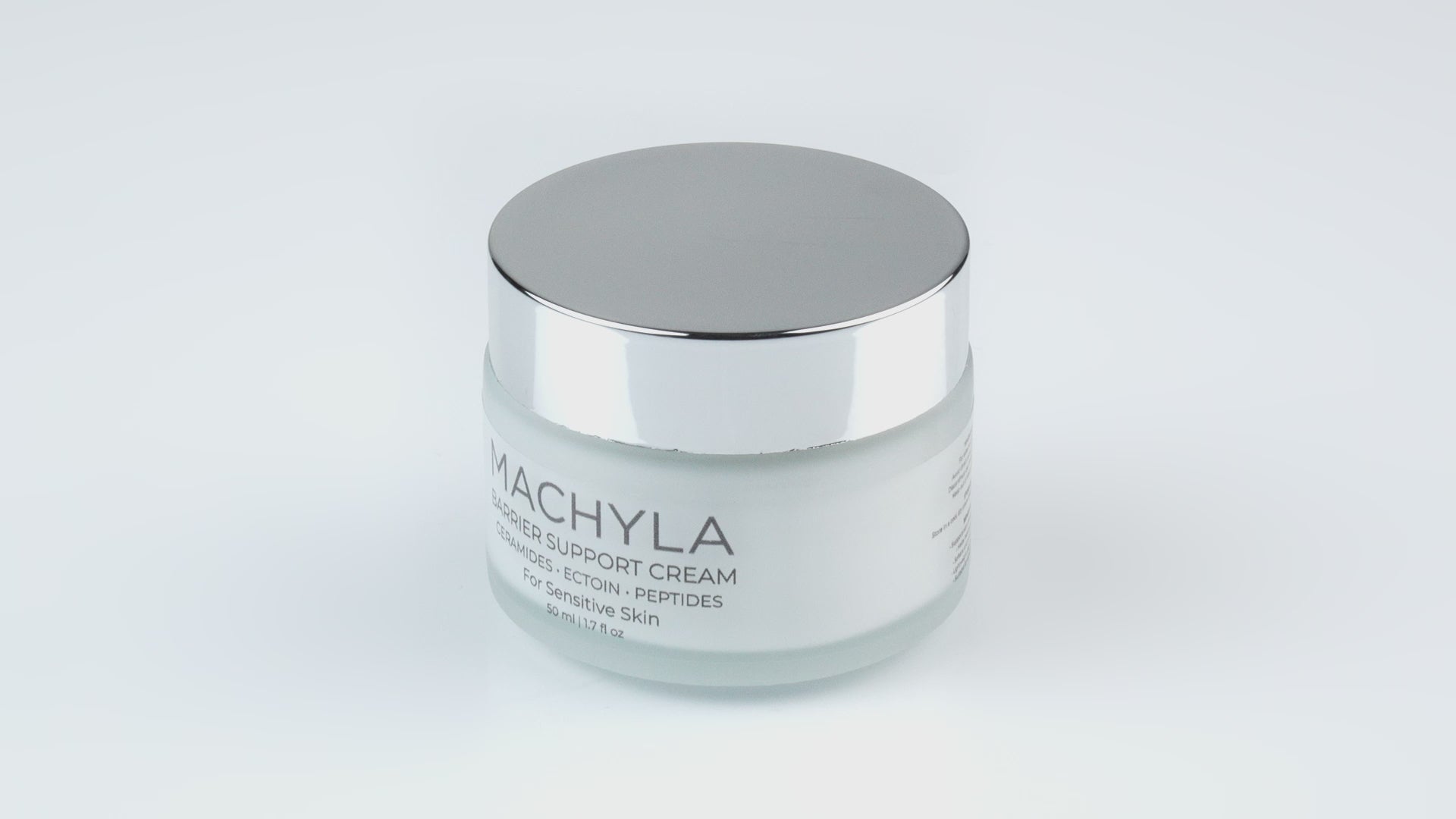 Load video: 360-degree view of the MACHYLA Barrier Support Cream frosted glass jar and premium packaging.